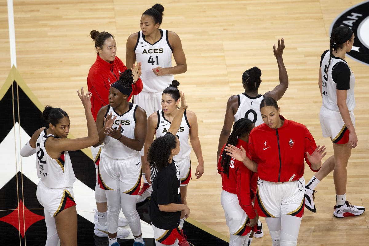 Las Vegas Aces react after a loss in overtime to the Phoenix Mercury during a WNBA game at Mich ...