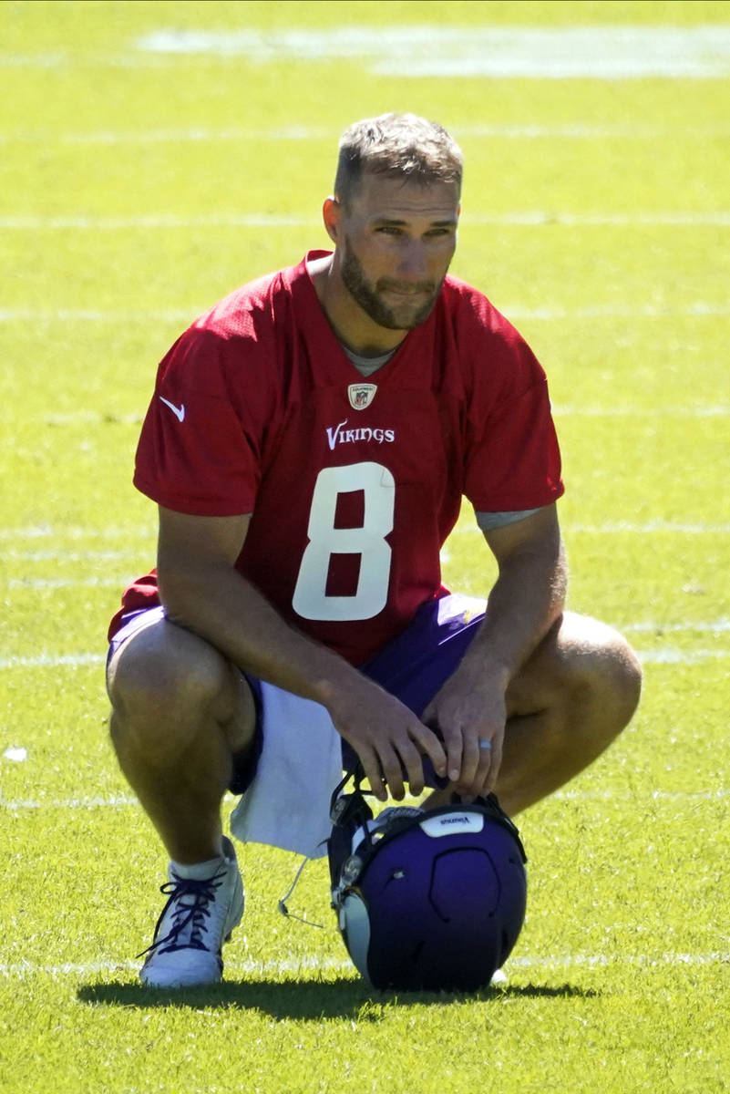 Minnesota Vikings quarterback Kirk Cousins (8) takes a breather during NFL football minicamp pr ...