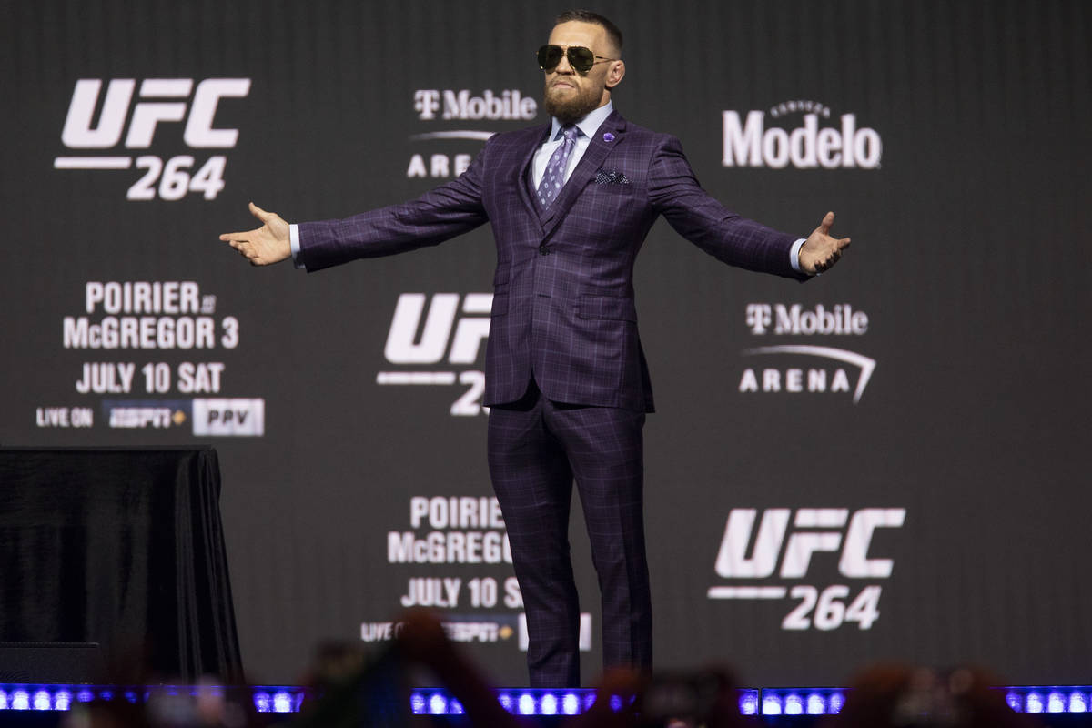 Conor McGregor takes the stage for an UFC 264 press conference at T-Mobile Arena in Las Vegas, ...