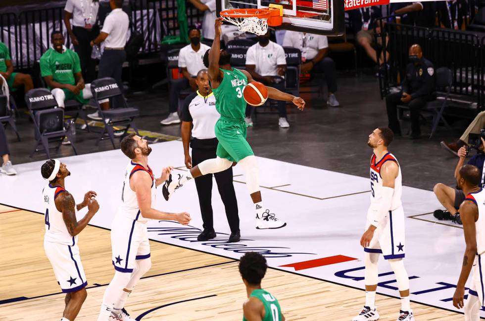 Ike Nwamu (34) dunks against USA during the first half of an exhibition basketball game ahead o ...