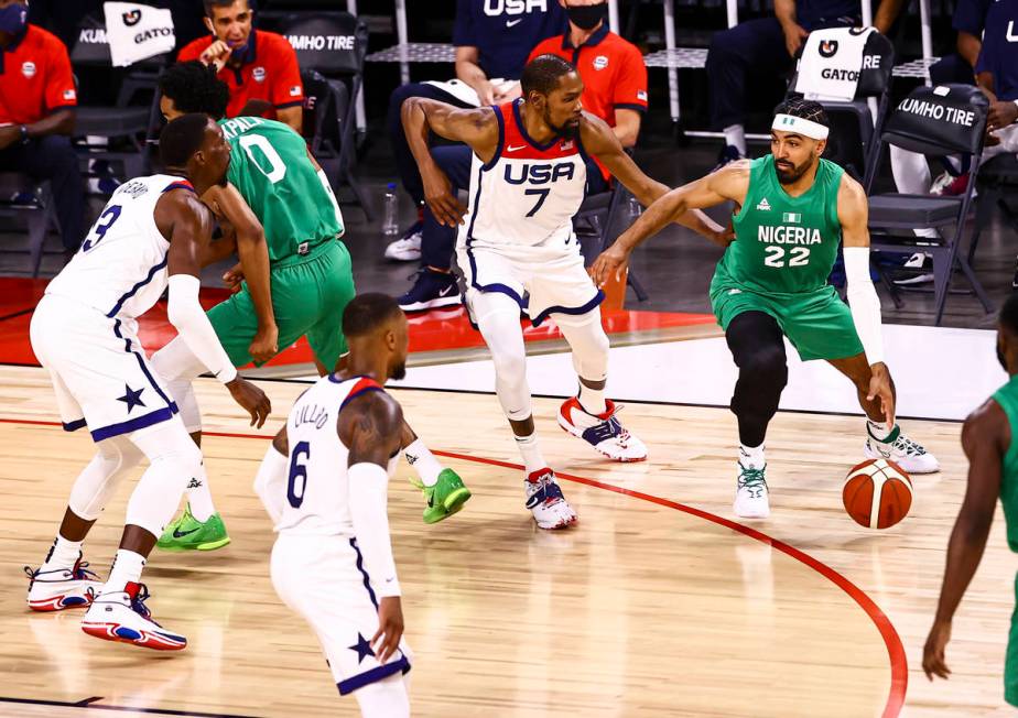 NigeriaÕs Gabe Nnamdi Vincent (22) drives the ball under pressure from USA Basketball's Ke ...