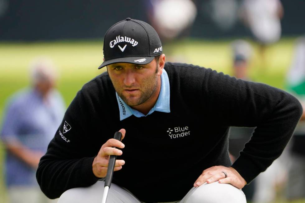 Jon Rahm, of Spain, lines up a putt during the second round of the U.S. Open Golf Championship, ...