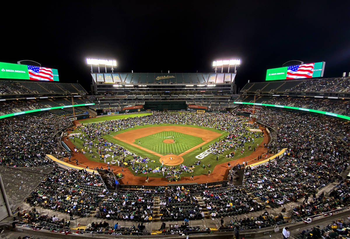Fans take to the field to watch fireworks following the game of the Oakland A‘s against the B ...