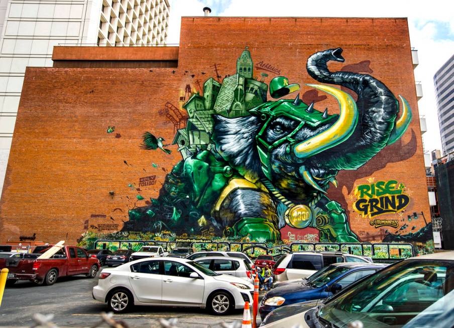 The Illuminaries, a local street art crew, spent three weeks spray painting the 105-foot mural ...