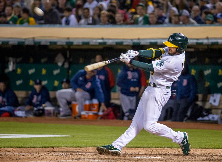 The Oakland A‘s infielder Jed Lowrie (8) hits a home run against the Boston Red Sox at RingCe ...