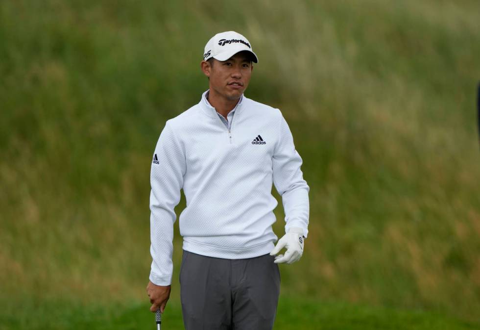 United States' Collin Morikawa look at the 2nd green after putting during a practice round for ...