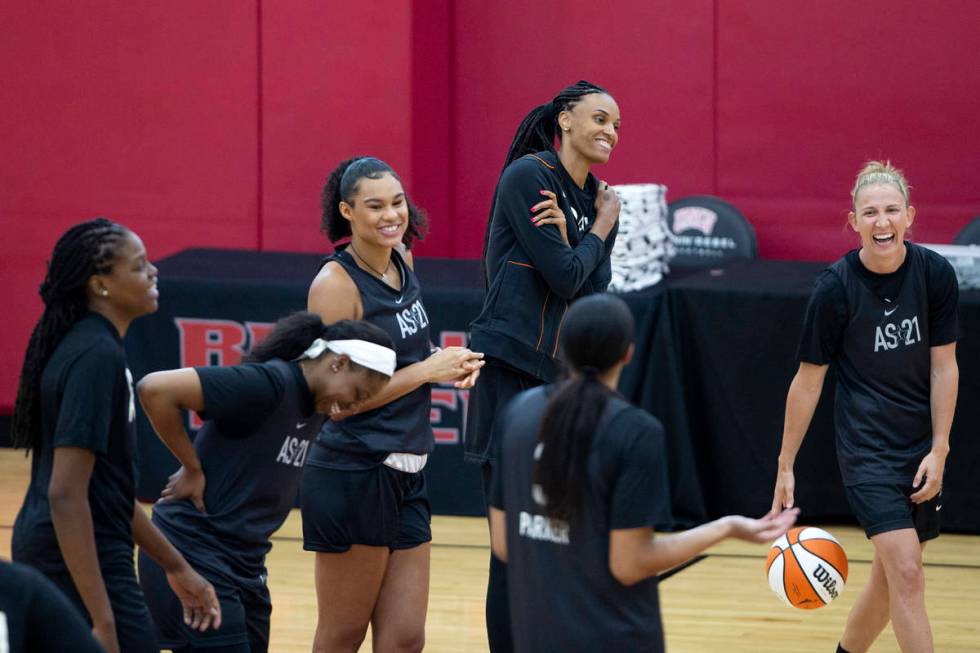 Members of the 2021 Team WNBA laugh during practice, including Courtney Vandersloot, right, DeW ...