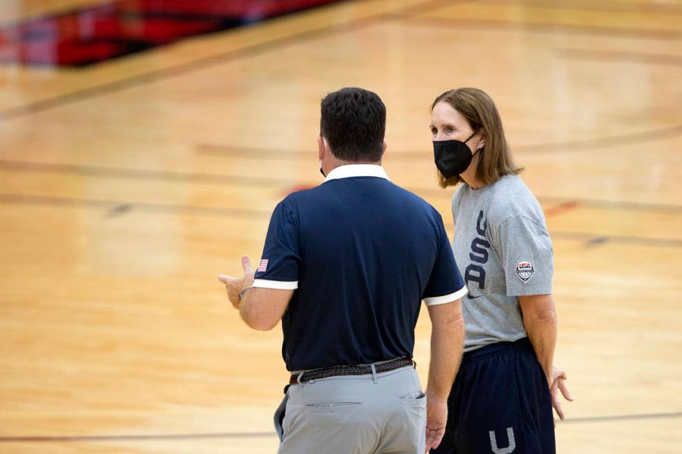 Assistant coach Cheryl Reeve, right, speaks with another staff member during a 2021 USA Basketb ...