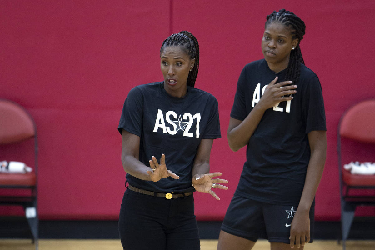 Co-head coach Lisa Leslie while Jonquel Jones listens behind her during a 2021 Team WNBA practi ...