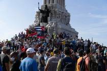 Anti-government protesters gather at the Maximo Gomez monument in Havana, Cuba, Sunday, July 11 ...