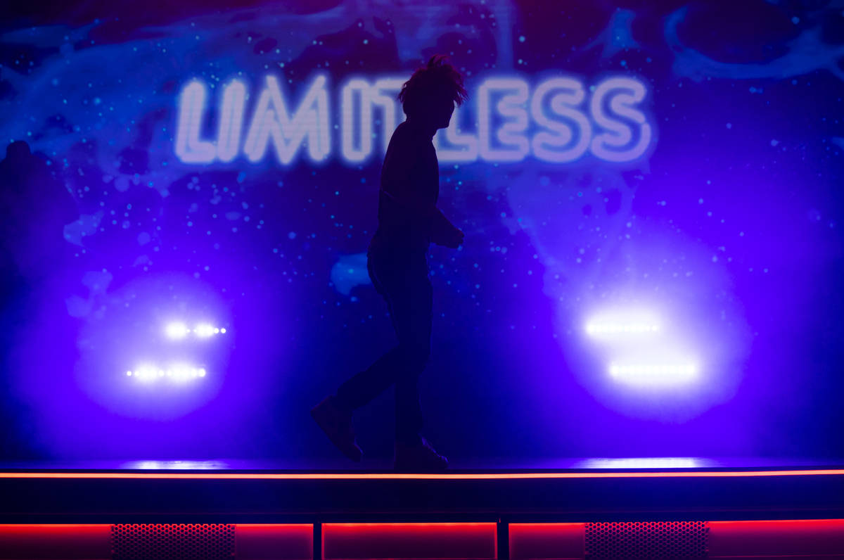 Illusionist Shin Lim is silhoutted onstage ahead of the reopening of his show, "Limitless, ...