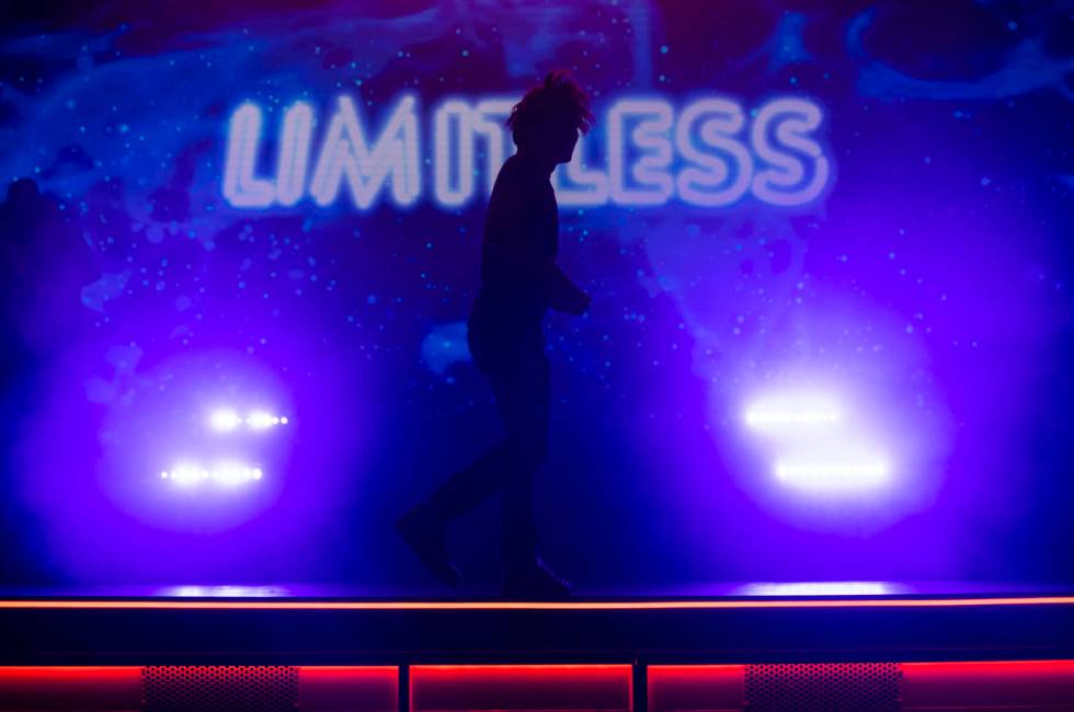 Illusionist Shin Lim is silhoutted onstage ahead of the reopening of his show, "Limitless, ...