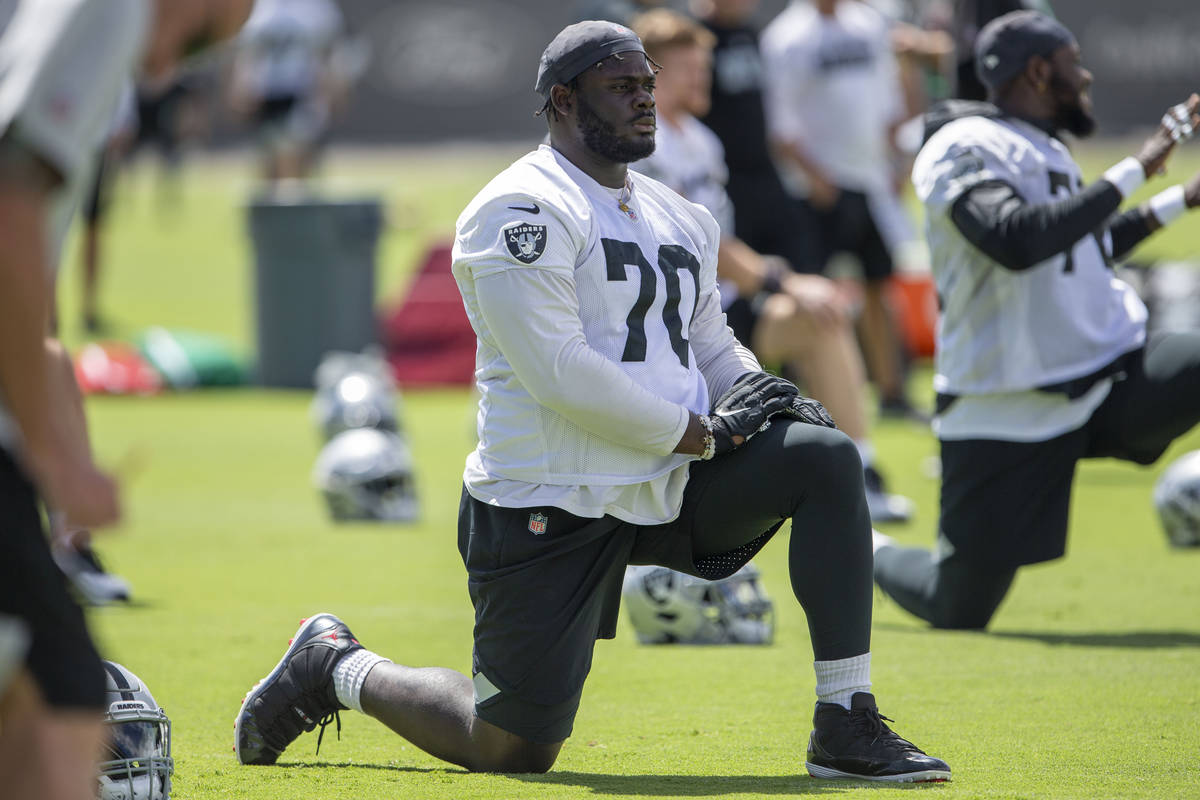 Raiders offensive tackle Alex Leatherwood (70) stretches during the teamÕs NFL football pr ...