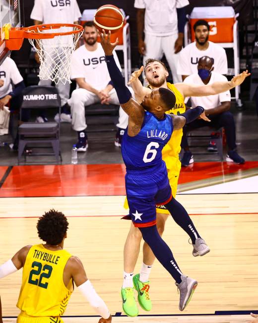 USA’s Damian Lillard (6) goes to the basket against Australia's Jock Landale (34) during ...