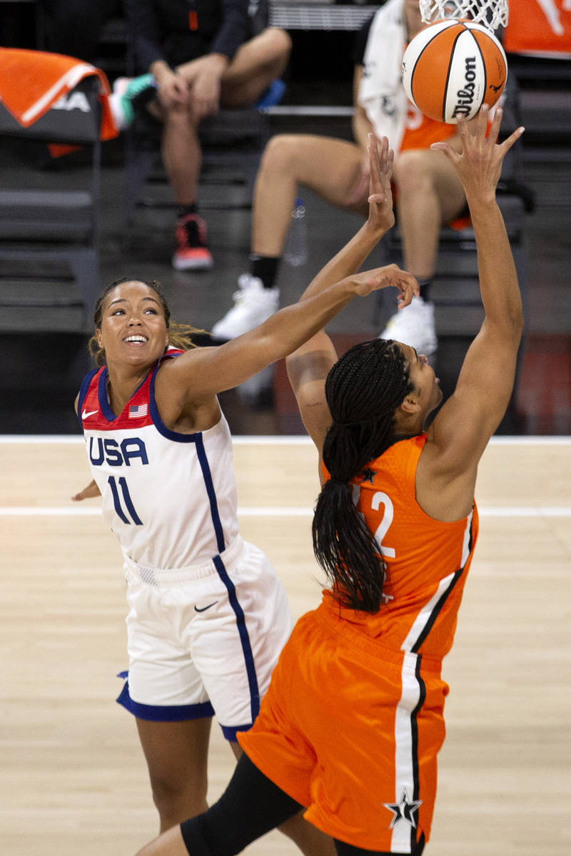 U.S. Women's National Team's Napheesa Collier (11) attempts to block a shot by Team WNBA's Brio ...
