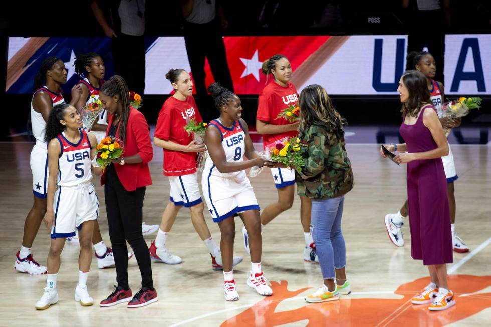 Current players present bouquets of flowers to members of the 1996 Olympic women's basketball t ...