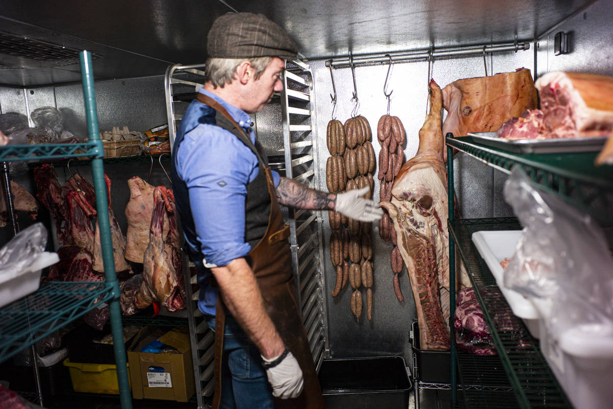 Martin Kirrane, owner and butcher at Featherblade Craft Butchery, shows a hog in the walk-in co ...