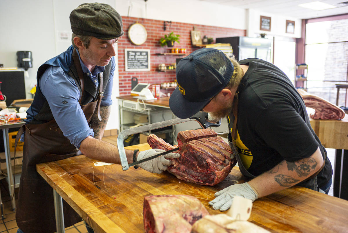Martin Kirrane, owner and butcher at Featherblade Craft Butchery, left, works with apprentice J ...