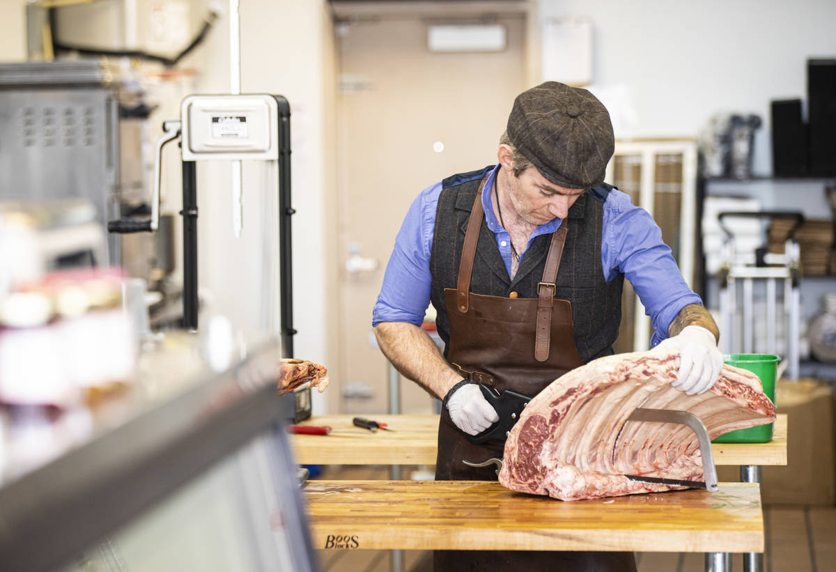 Martin Kirrane, owner and butcher at Featherblade Craft Butchery, carves beef at his shop in La ...