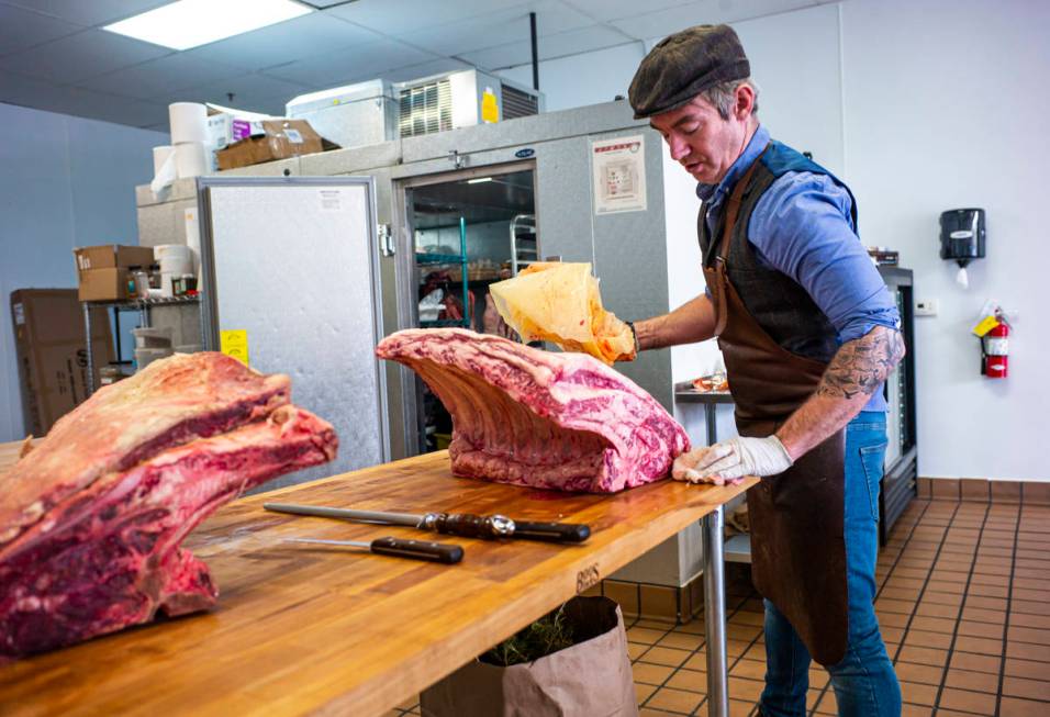 Martin Kirrane, owner and butcher at Featherblade Craft Butchery, prepares to carve beef at his ...