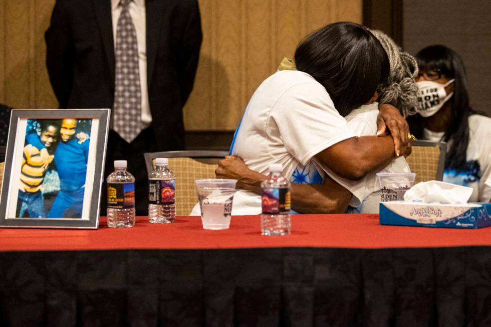 Robyn Lewis, left, and Cheryl Lewis, sisters of Byron Williams, embrace during a news conferenc ...