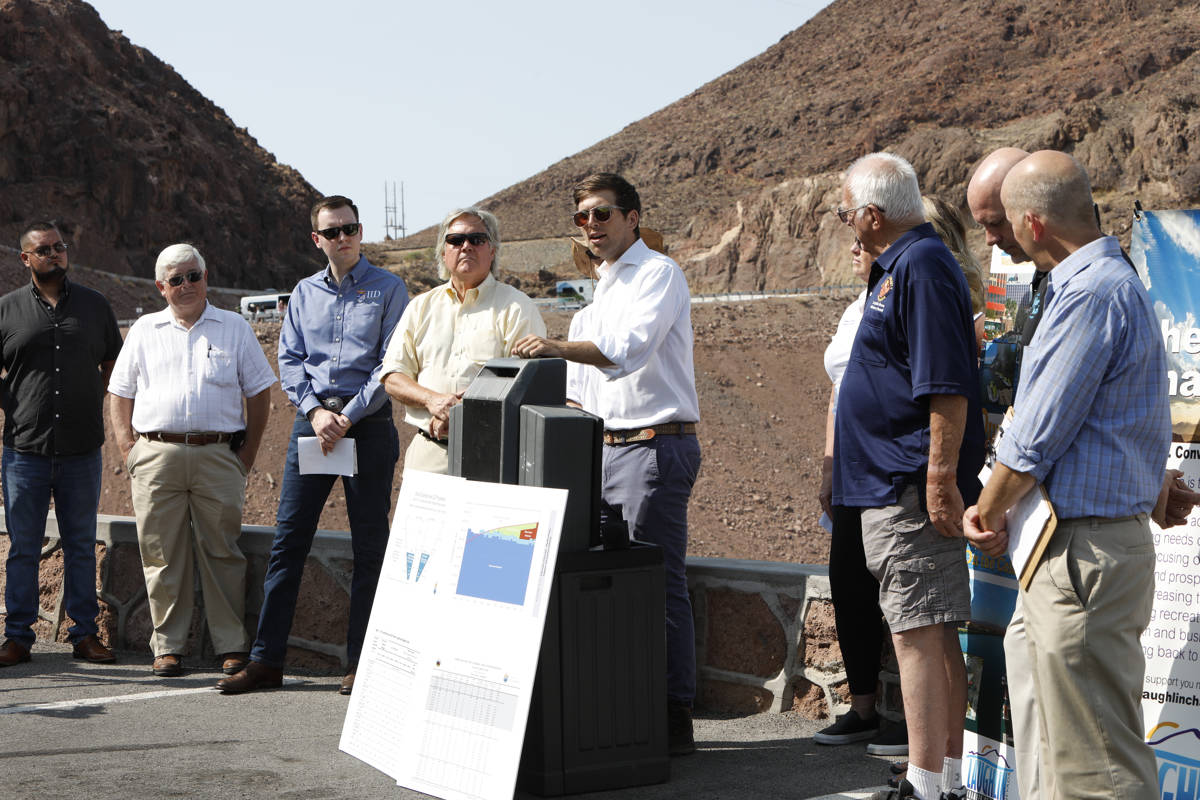 Kyle Roerink of Great Basin Water Network, center, speaks during a news conference at the Hoove ...