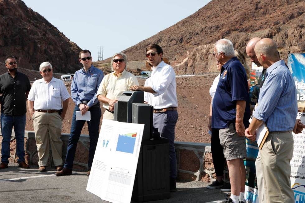 Kyle Roerink of Great Basin Water Network, center, speaks during a news conference at the Hoove ...