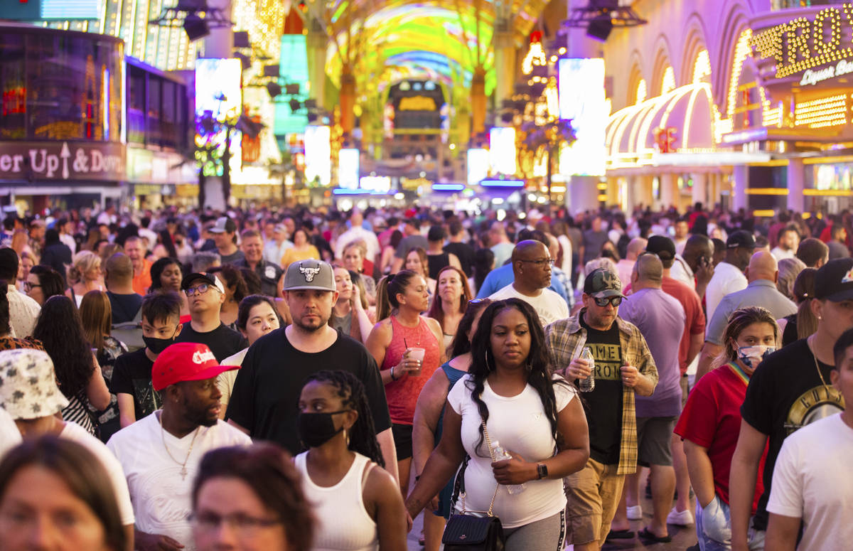 Visitors take in the sightsat the Fremont Street Experience during Memorial Day weekend on Satu ...