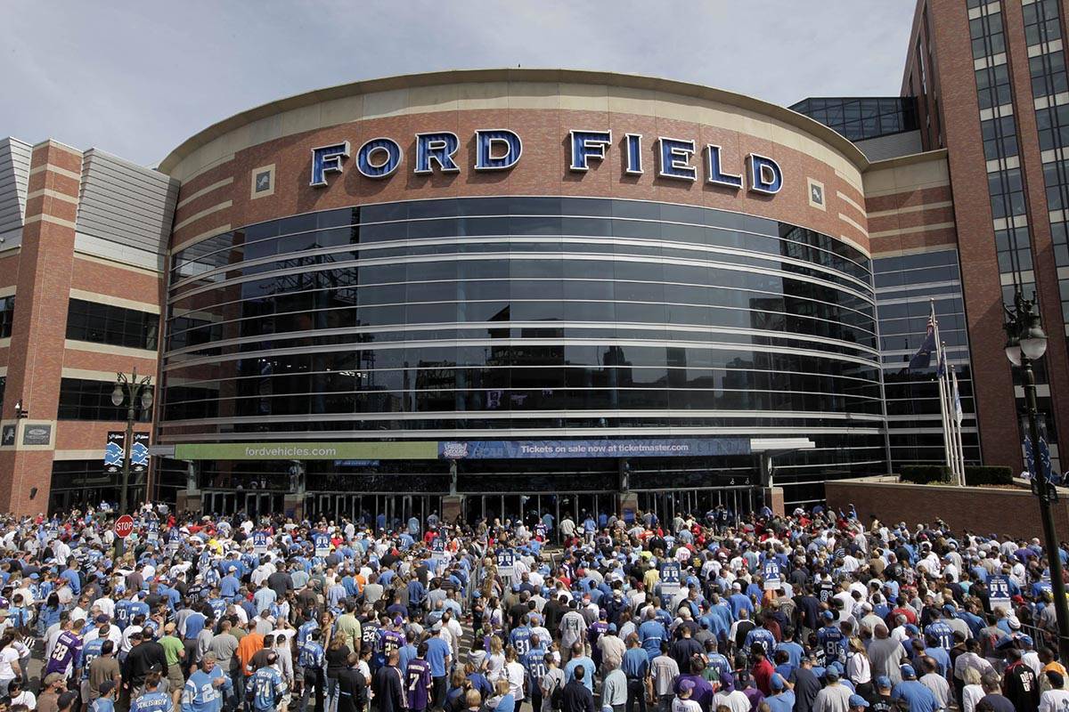 Fans arrive to Ford Field before and NFL football game between the Detroit Lions and Minnesota ...