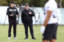 Oakland Raiders general manager Mike Mayock, left, and head coach Jon Gruden watch the team pra ...