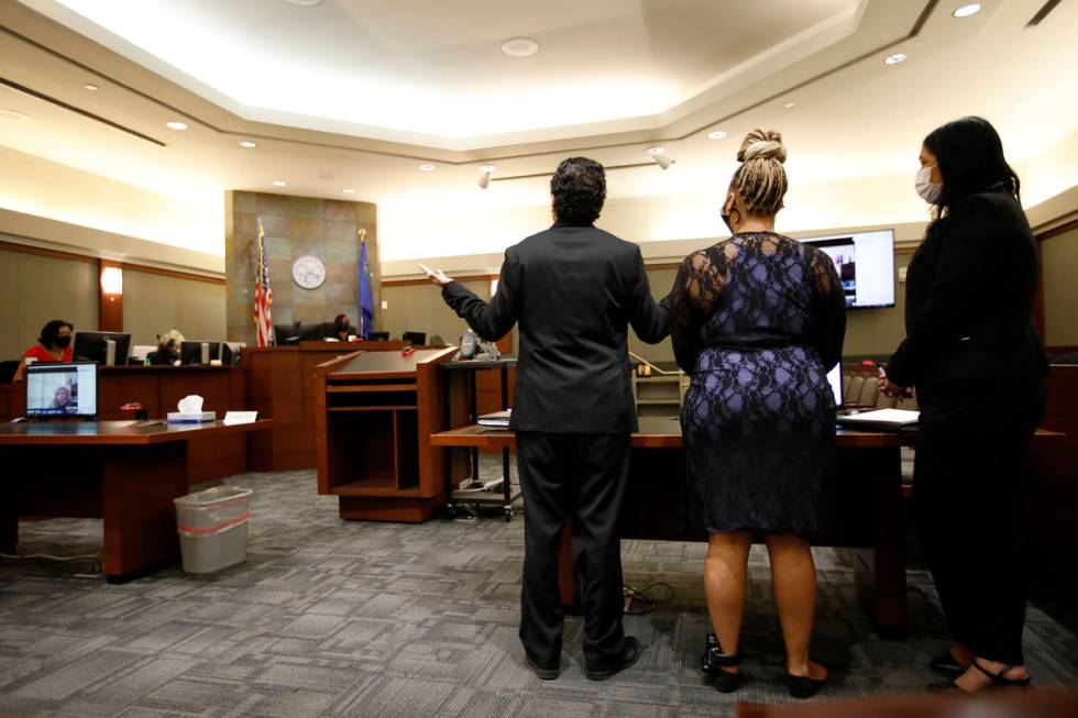 Attorney Michael Castillo, left, speaks in front of Judge Tierra Jones during a bail hearing fo ...