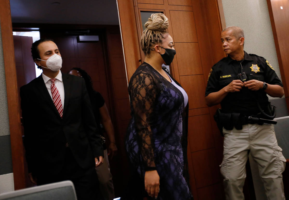 Cadesha Bishop enters the courtroom her attorney Michael Castillo, left, before her bail hearin ...