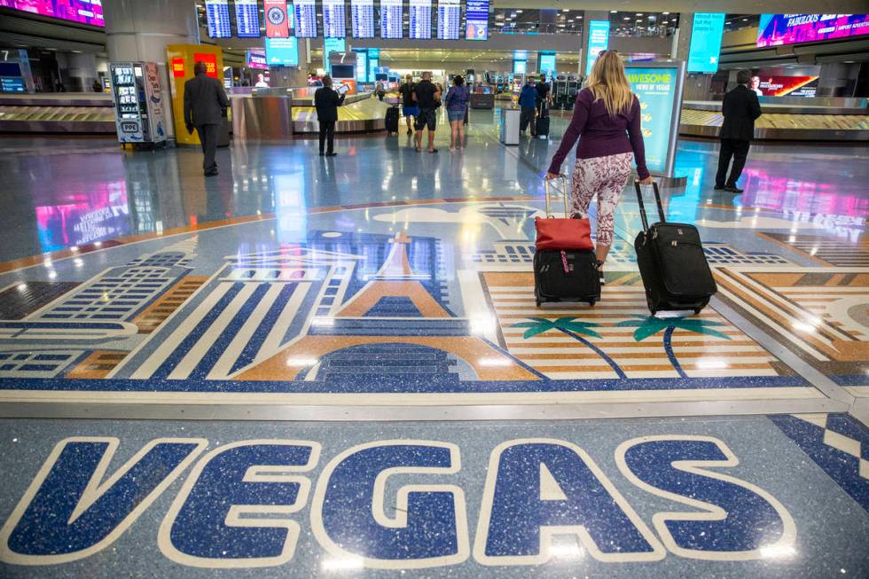 Travelers at McCarran International Airport Terminal 1 in Las Vegas, Thursday, May 13, 2021. (E ...