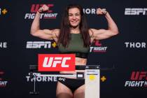 Miesha Tate poses on the scale during the UFC Fight Night weigh-in at UFC APEX on June 25, 2021 ...