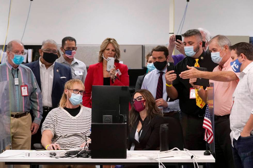 FILE - In this Wednesday, Nov. 18, 2020 file photo, Arizona election staff, other state officia ...