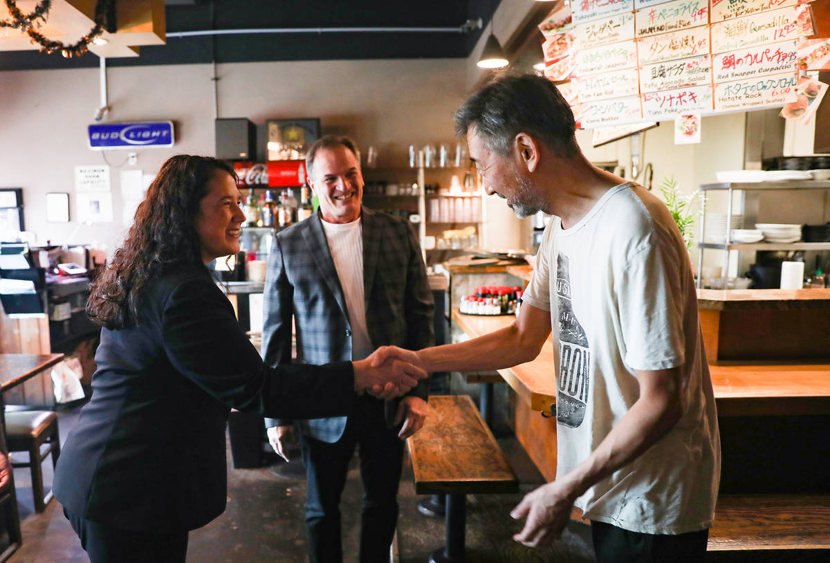 Isabella Casillas Guzman, administrator of the Small Business Administration, shakes hands wit ...