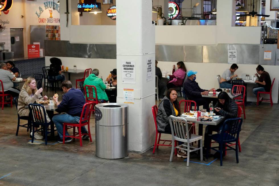 FILE - In this March 17, 2021 file photo Patrons eat lunch in an indoor space at Grand Central ...