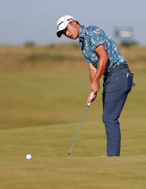United States' Collin Morikawa makes a birdie putt on the 14th hole uring the final round of th ...
