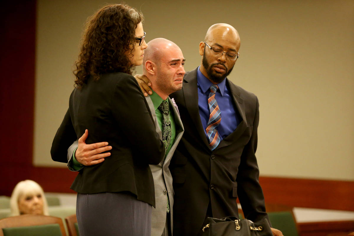 Former Las Vegas police explorer Joshua Honea, center, reacts with his attorneys, Monique McNei ...