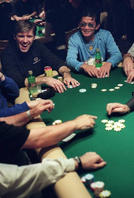 Scotty Nguyen, right, and Layne Flack smile as they play during the World Poker Tour at the Bel ...