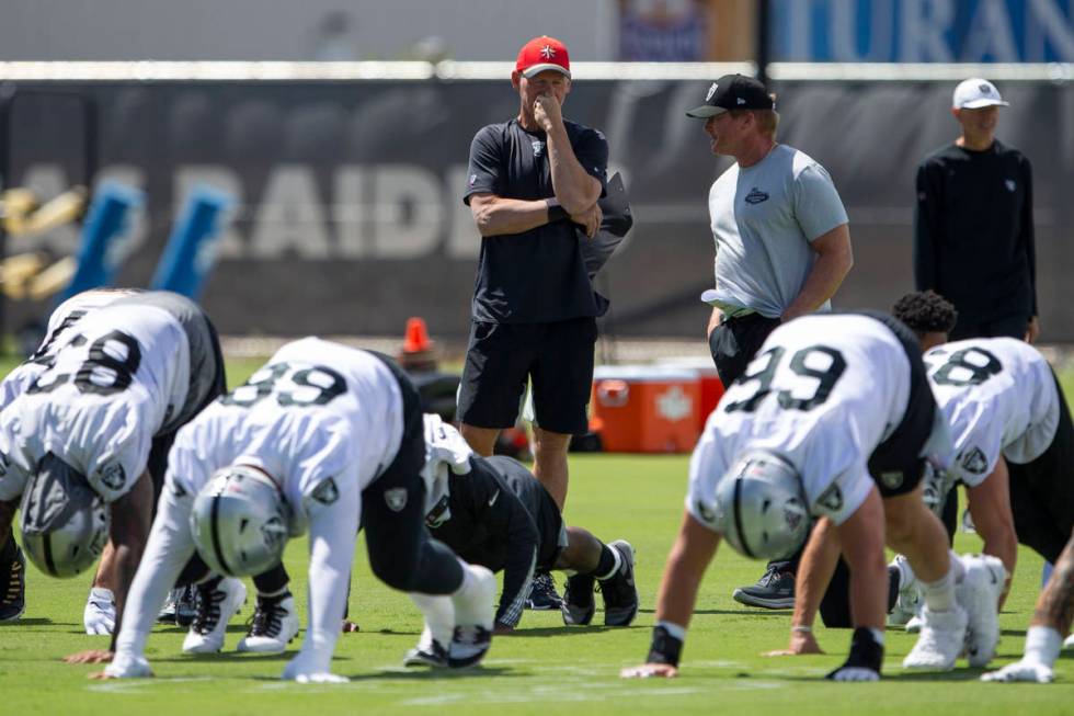 Raiders general manager Mike Mayock, left, and head coach Jon Gruden watch the team stretch dur ...