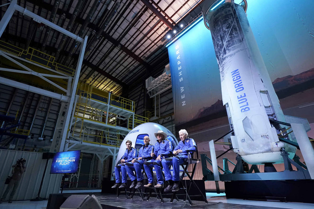 Oliver Daemen, from left, Mark Bezos, Jeff Bezos, founder of Amazon and space tourism company B ...