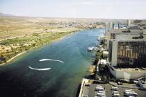 The Colorado River, the dividing line between the towns of Laughlin and Bullhead City, Ariz. (L ...