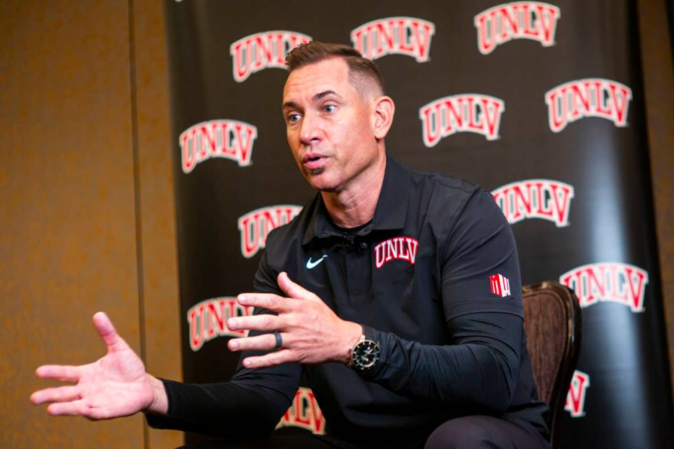 UNLV football coach Marcus Arroyo responds to questions during Mountain West Conference media d ...