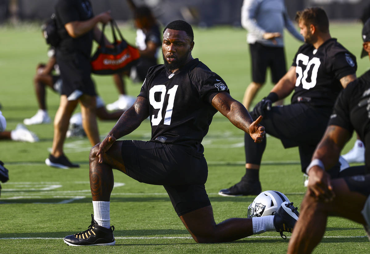 Raiders defensive end Yannick Ngakoue (91) stretches during an NFL football minicamp at Raiders ...