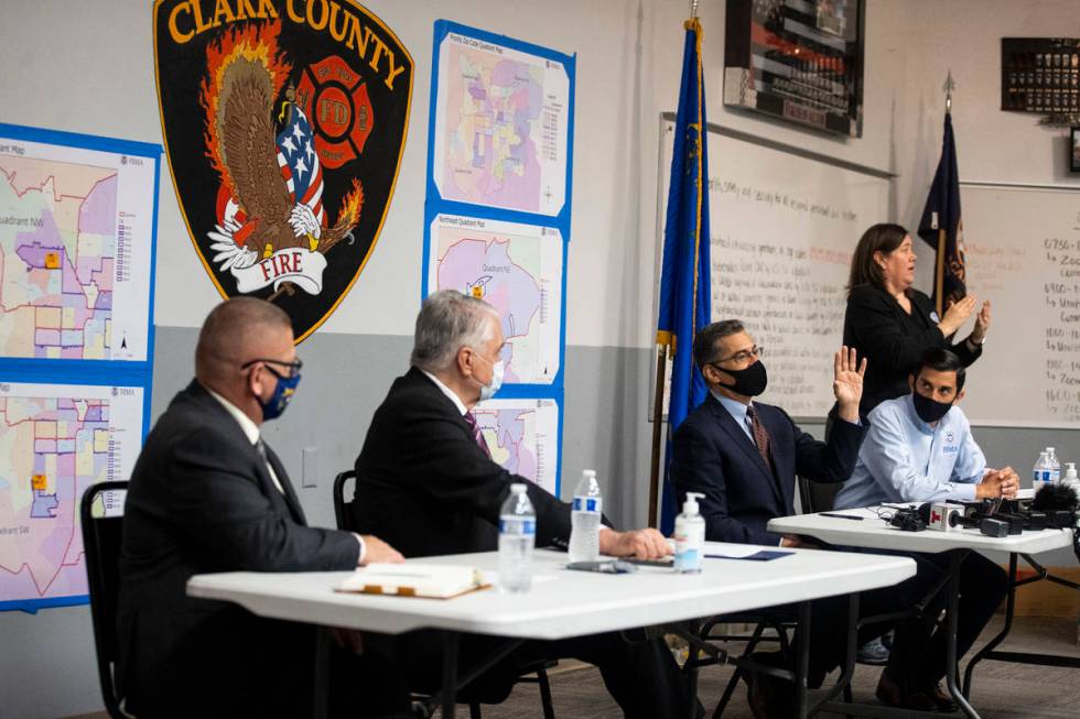 U.S. Health and Human Services Secretary Xavier Becerra, third from left, speaks during a brief ...