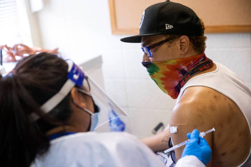 Dino Poston receives the COVID-19 vaccination at the Sherman Gardens Vaccination Clinic in Las ...