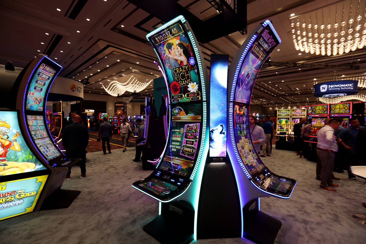Aristocrat slot machines with the signature curved cabinet in the Aristocrat Technologies booth ...