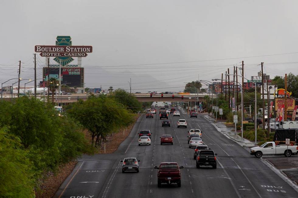 Traffic moves on Boulder Highway with stormy skies in the background on Thursday, July 22, 2021 ...