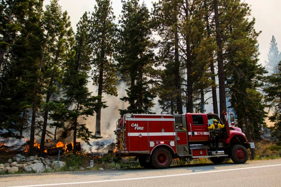 So-Cal firefighters battle the Tamarack Fire around California State Route 88 near Alpine Villa ...